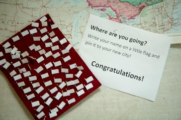 Students pinned flags to the various cities in Canada where they will be completing residencies.